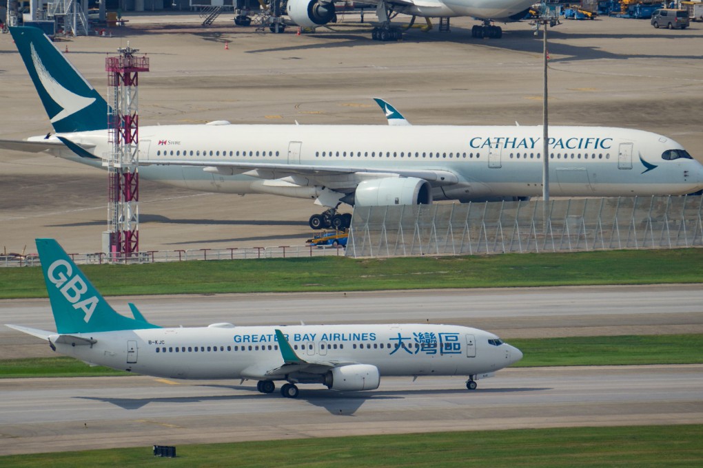 Greater Bay Airlines and Cathay Pacific aircrafts parked at Hong Kong International Airport. Photo: May Tse