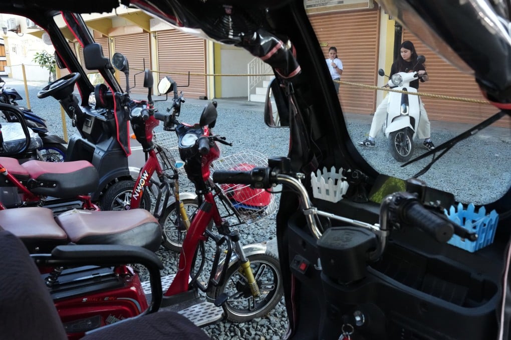 Filipinos test ride electric bikes they explore ways to save on transport costs following oil price spikes on Thursday. Photo: AP