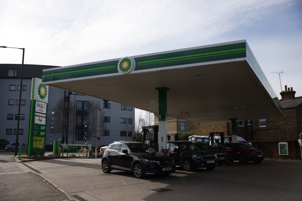 Cars refuel at a BP petrol station in London, Britain, on Tuesday. Global oil prices have risen sharply amid the conflict in the Middle East. Photo: EPA