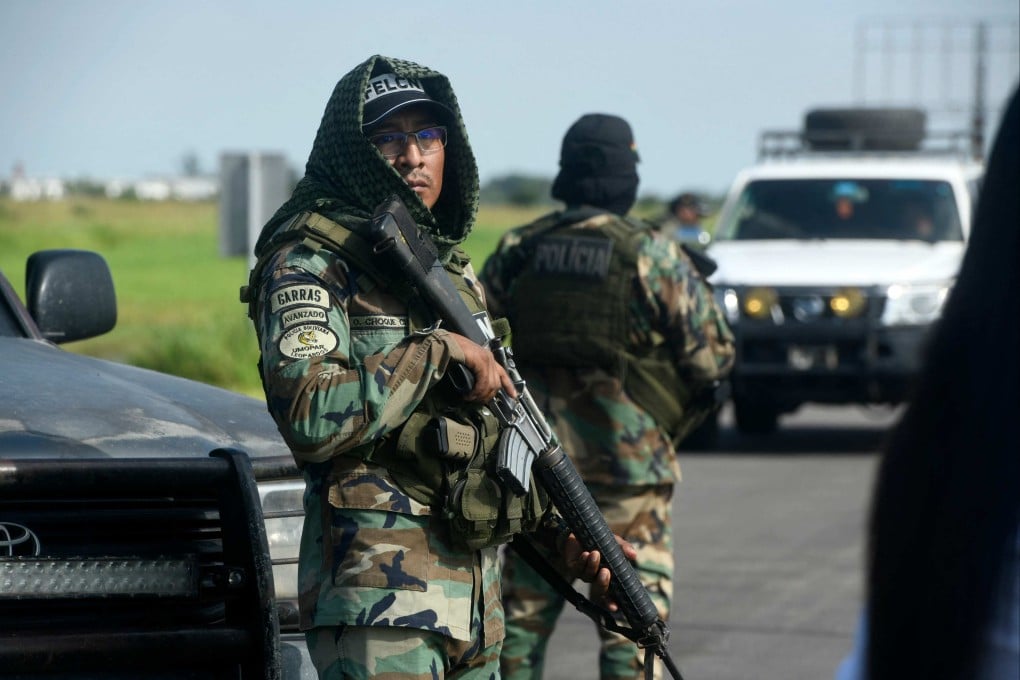 Police officers stand guard at the Viru Viru airport in Santa Cruz, Bolivia, where Sebastian Enrique Marset Cabrera is reportedly being transferred on Friday. Photo: AFP