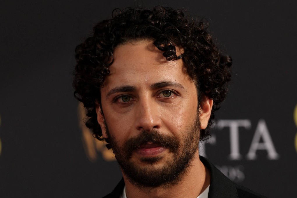 Palestinian actor Motaz Malhees poses on the red carpet at the Bafta award ceremony on February 22. Photo: AFP