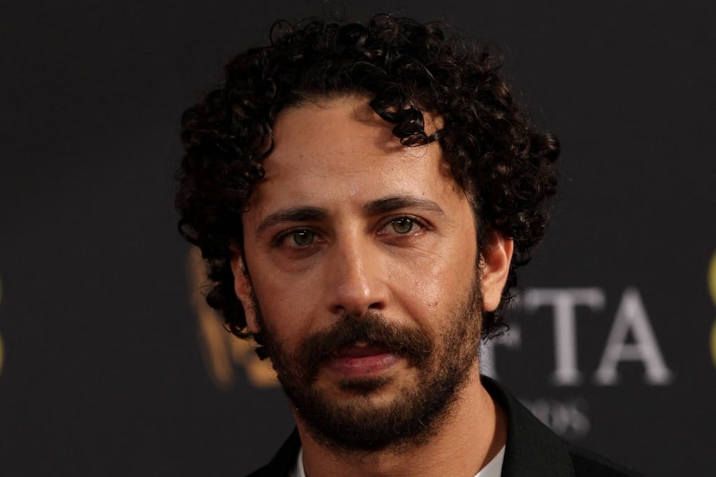 Palestinian actor Motaz Malhees poses on the red carpet at the Bafta award ceremony on February 22. Photo: AFP