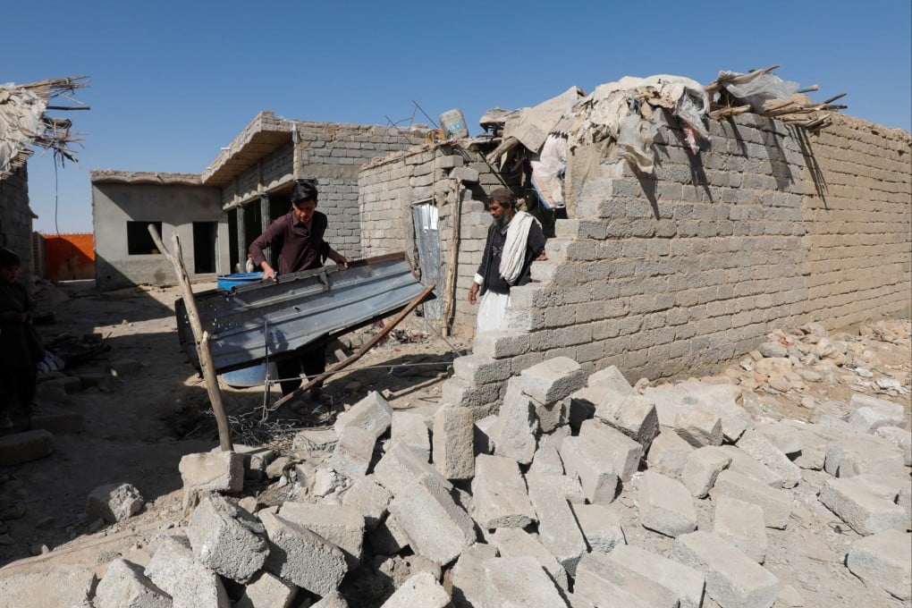 Residents inspect the damage after what locals say was a possible drone that hit a residential house in the Sarah Gharghai area, in Quetta, Pakistan, on Saturday. Photo: Reuters