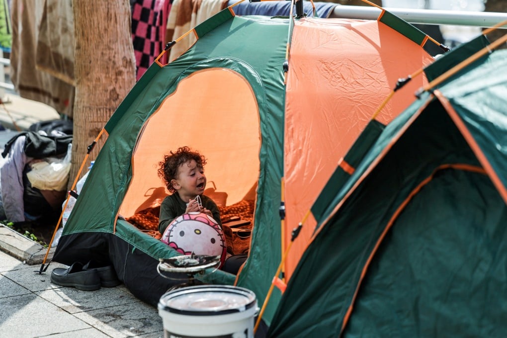 A displaced child sits inside a roadside tent by the sea, following an escalation between Hezbollah and Israel amid the US-Israeli conflict with Iran, in Beirut, Lebanon, on Friday. Photo: Reuters
