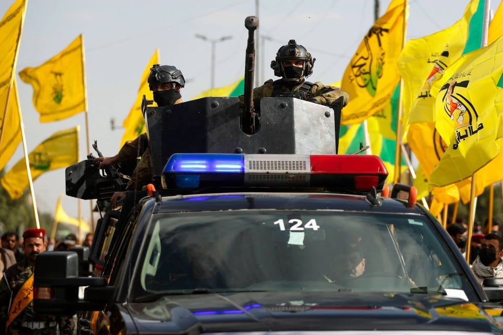 Iraqi security forces stand guard during the funeral procession of Kataeb Hezbollah members on March 5. Photo: AFP
