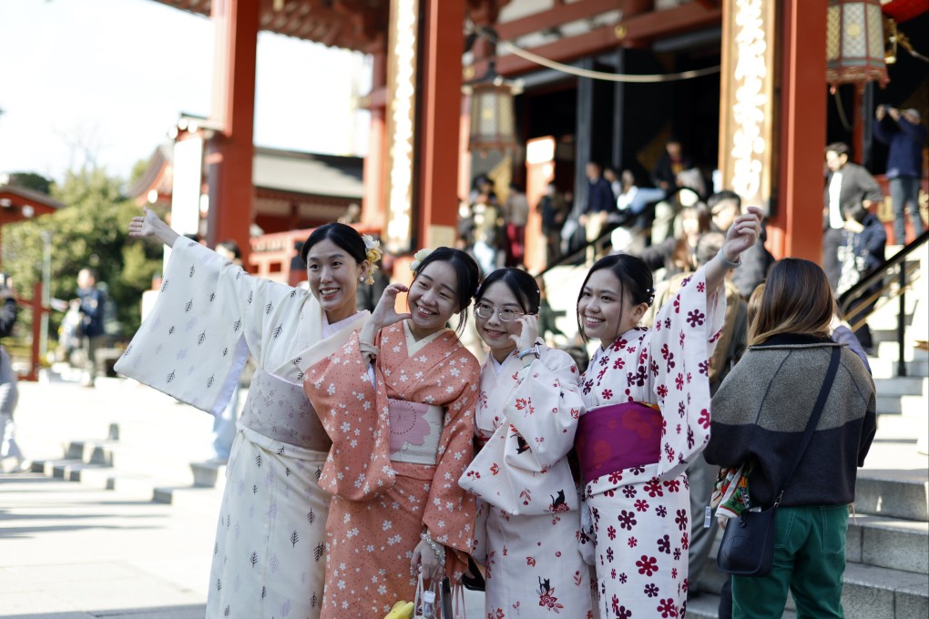 Tourists visit Sensoji Temple in Tokyo’s historic Asakusa district in December. Photo: EPA