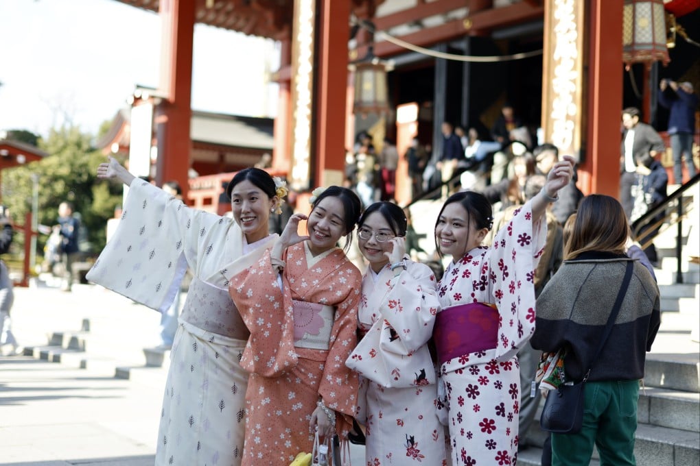 Tourists visit Sensoji Temple in Tokyo’s historic Asakusa district in December. Photo: EPA