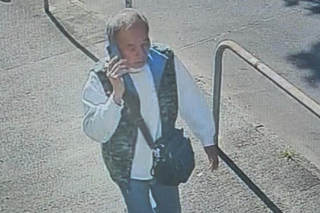 A photo released by authorities shows Lau Kin‑pong talking on his phone while walking along a pavement before he went missing. Photo: Handout