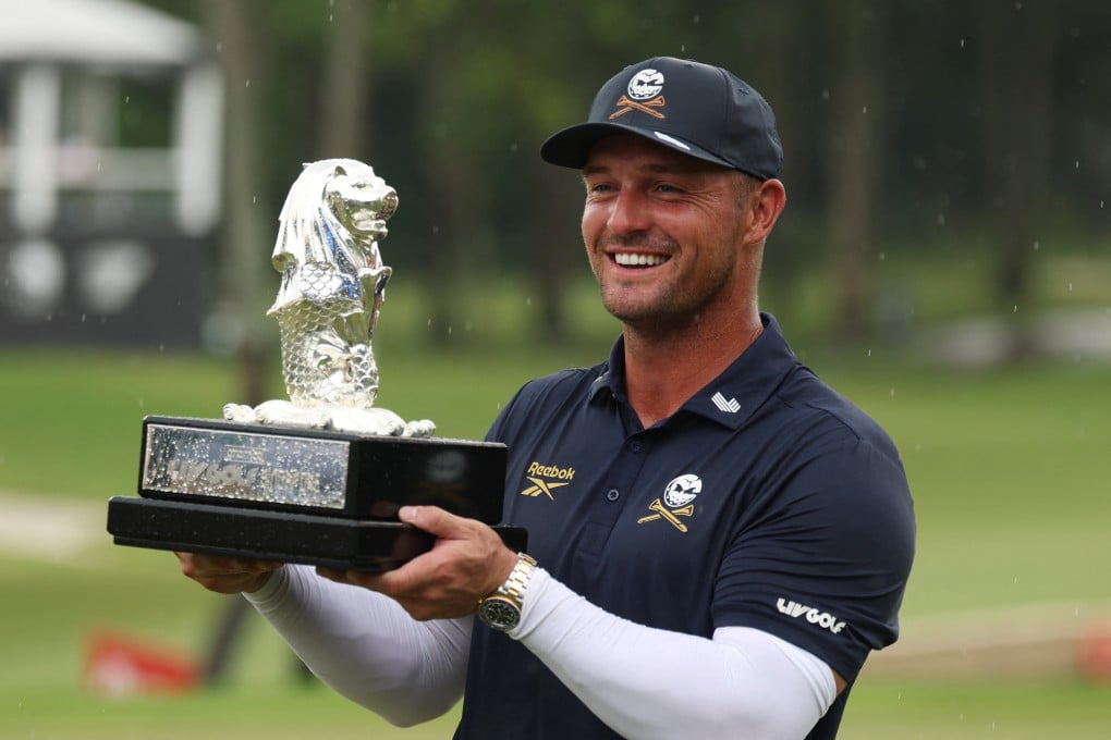 Bryson DeChambeau celebrates with his trophy after winning LIV Golf Singapore at Sentosa Golf Club on Sunday. Photo: Reuters