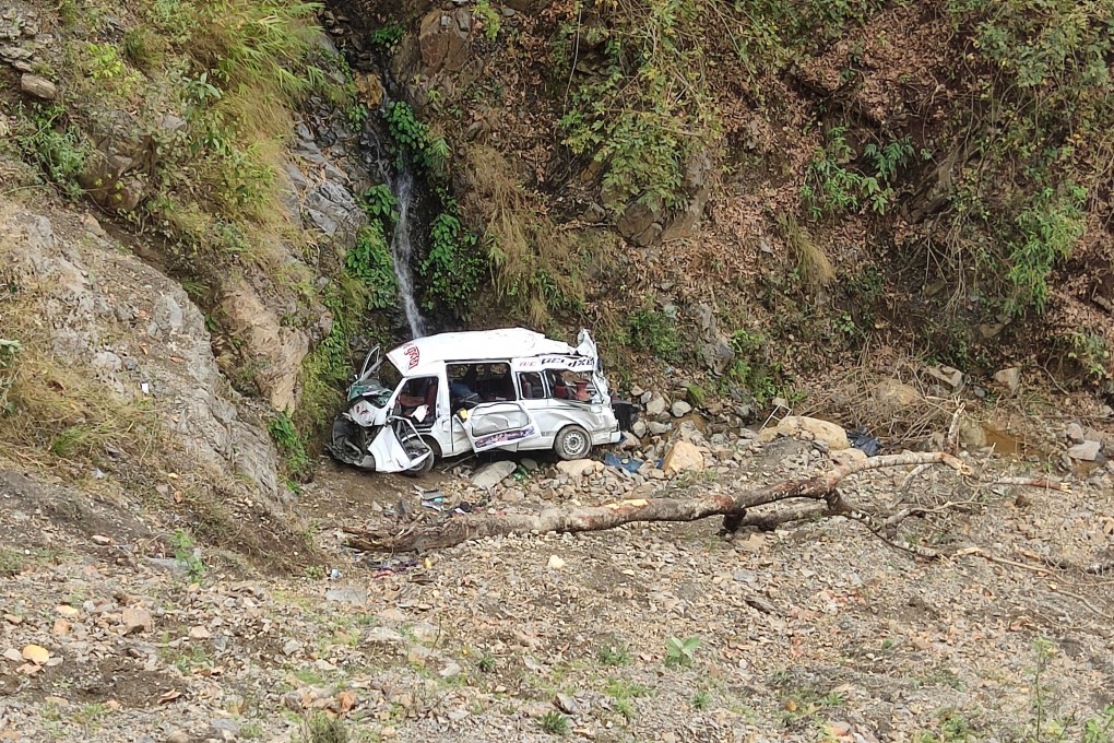 The wreckage of a bus that rolled down a mountain slope, killing seven, sits at Shahid Lakhan village, west of Nepal’s capital Kathmandu, on Sunday. Photo: AP