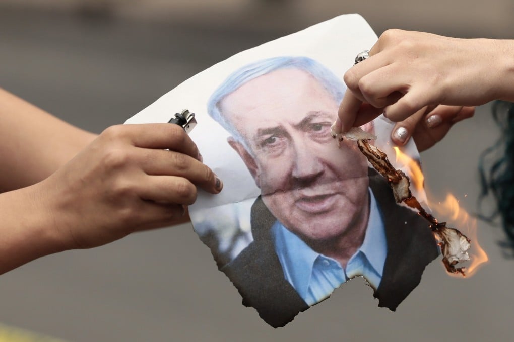 People burn an image of Israeli Prime Minister Benjamin Netanyahu during a demonstration in Mexico on Saturday. Photo: EPA