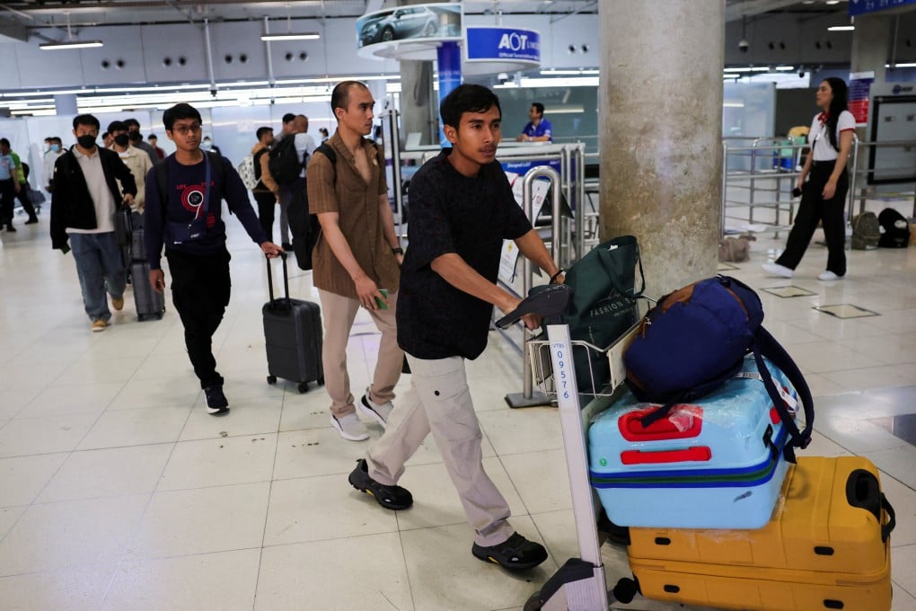 Thai crew members, rescued after their ship was hit by projectiles in the Strait of Hormuz, arrive at Suvarnabhumi International Airport in Bangkok, Thailand. Photo: Reuters
