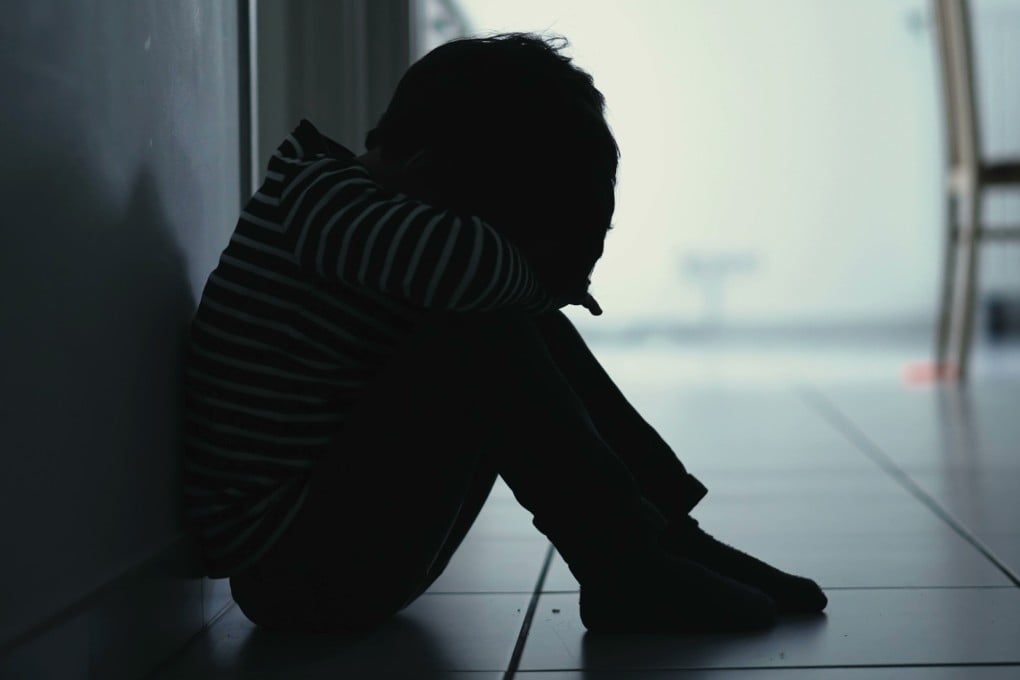 A young child huddles against a wall. Nathan Bennett sexually abused five boys at the nursery where he worked. Photo: Shutterstock