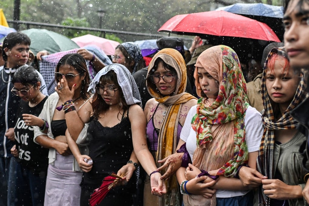 Filipinos take part in a protest in Manila to commemorate International Women’s Day on March 8. Photo: Reuters