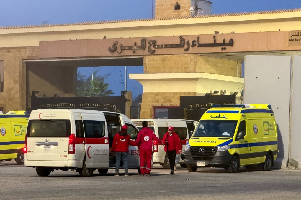Egyptian ambulances go through the Rafah border crossing on the Egyptian side in Rafah, Egypt on February 10. On Sunday, Israel said the crossing will open on Wednesday for limited movement of people in both directions. Photo: Reuters