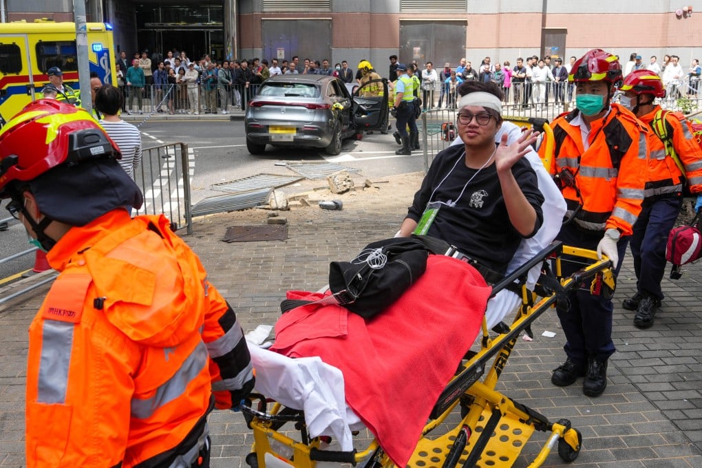 Nine people have been taken to hospital after a car mounted the pavement on Lam Hing Street in Kowloon Bay. Photo: Sam Tsang