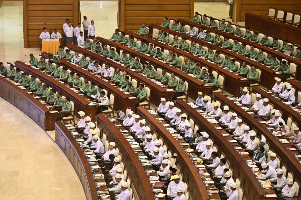 Military representatives (in green) and other members of Myanmar’s parliament attend a session in Naypyidaw on Monday. Photo: AFP