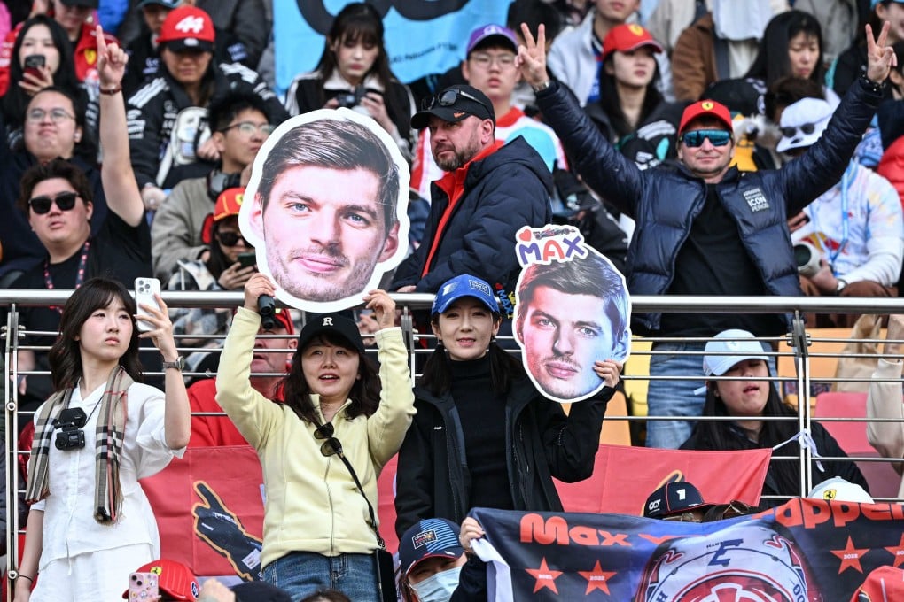 Supporters cheer with signs featuring the face of Red Bull Racing driver Max Verstappen prior to the Formula One Chinese Grand Prix at the Shanghai International Circuit. Photo: AFP