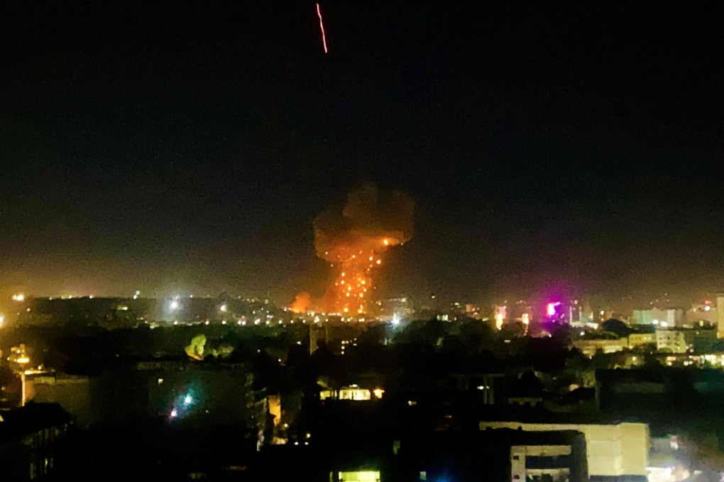 Smoke and flames rise from an area hit by air strikes in Kabul, Afghanistan, on Monday. Photo: AFP