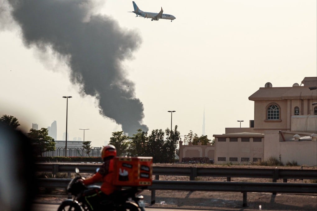 Smoke rises near Dubai airport from a fire caused by a “drone-related incident”. Photo: AFP