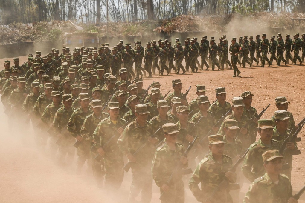 Members of ethnic rebel group Ta’ang National Liberation Army take part in a training exercise at their base camp in Myanmar’s northern Shan State. Photo:  AFP