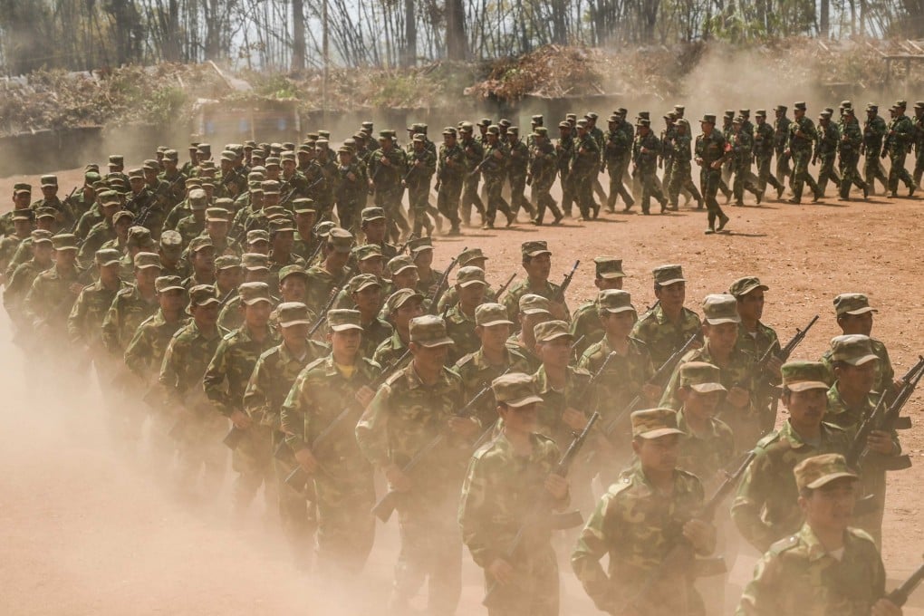 Members of ethnic rebel group Ta’ang National Liberation Army take part in a training exercise at their base camp in Myanmar’s northern Shan State. Photo: AFP