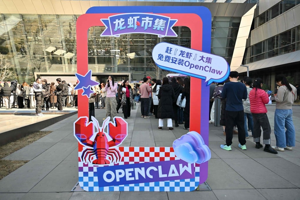 People queue to have OpenClaw, an open-source AI assistant, installed on their devices, at Baidu’s headquarters in Beijing on March 11. Photo: AFP
