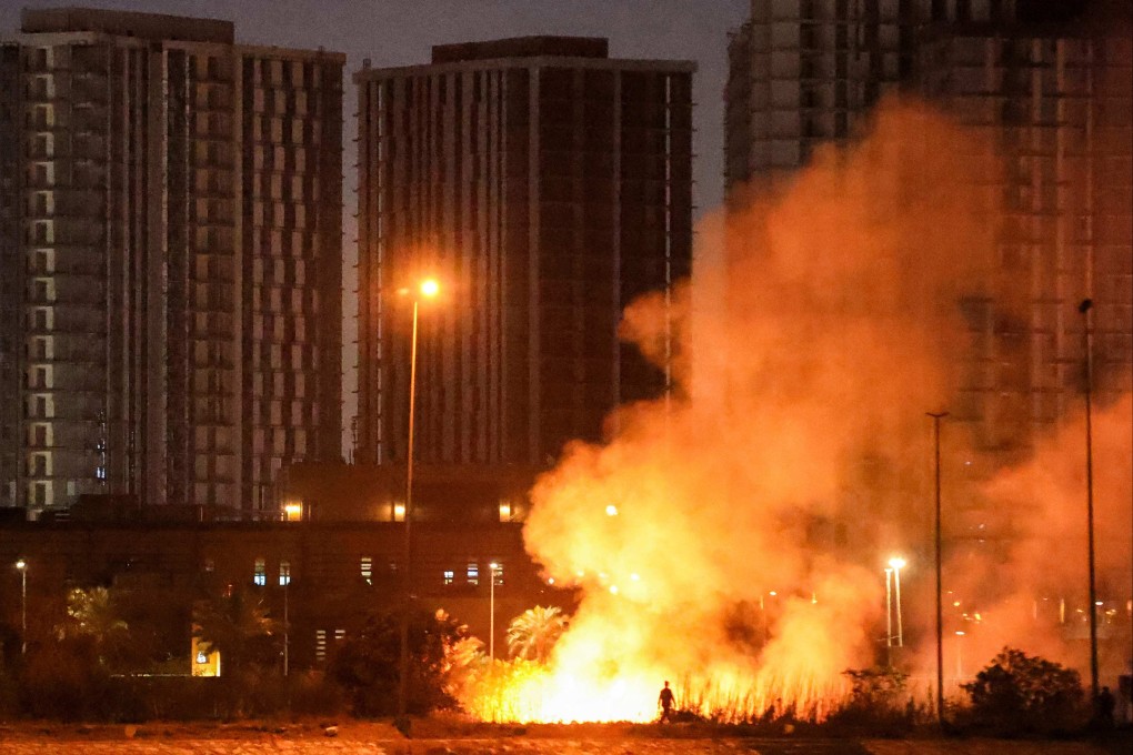 A fire burns on the grounds of the US embassy in Baghdad’s fortified ‘Green Zone’. Photo: AFP