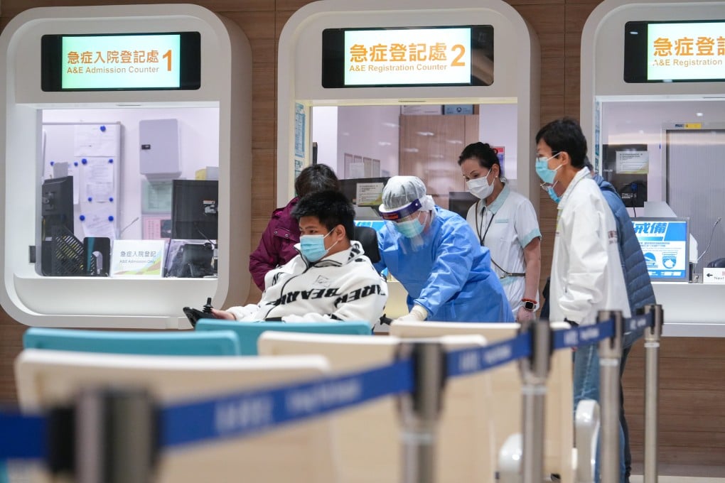 Hospital staff wheel a patient into Kwong Wah Hospital’s accident and emergency department on January 1. Photo: Sun Yeung