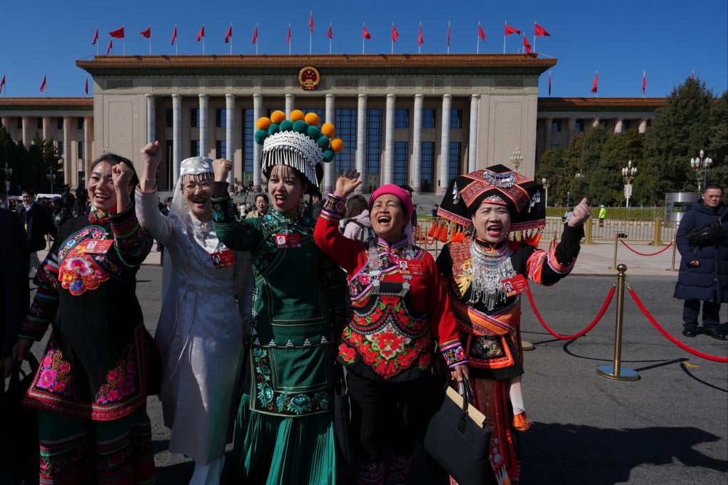 Ethnic minority delegates leave after a plenary session of the National People’s Congress held at the Great Hall of the People in Beijing on March 9. Photo: AP