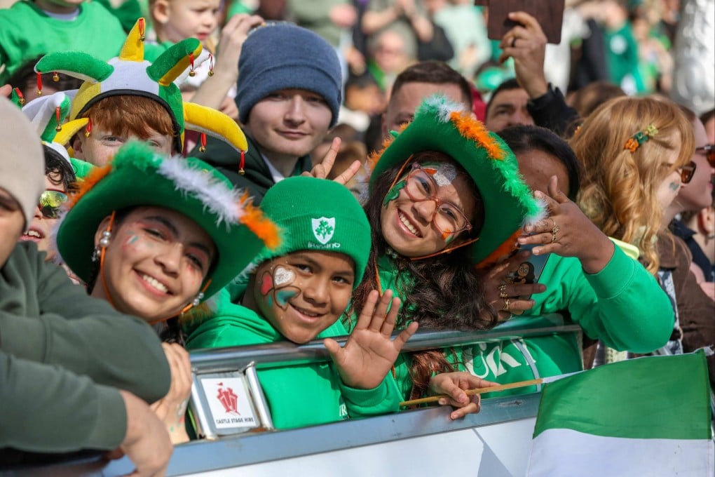 People watch the annual St Patrick’s Day parade through the city centre of Dublin, Ireland, on March 17. Photo: AFP