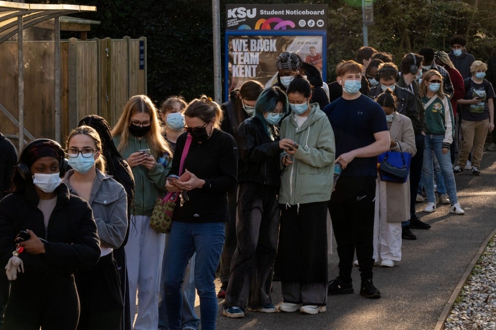 People queue to receive vaccinations at the University of Kent campus. Photo: Reuters