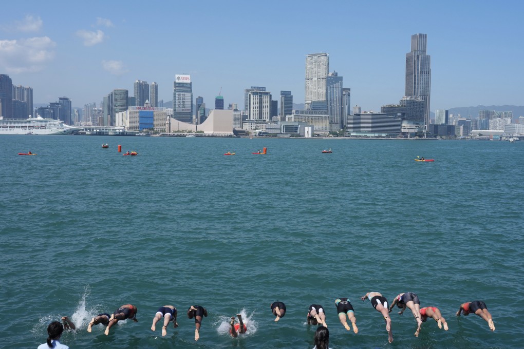 Athletes enter the water at the start of the under-23 mixed team relay at the Asian Triathlon Championships. Photo: Karma Lo