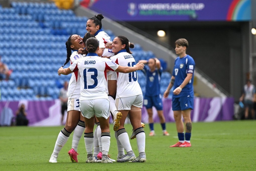 Jaclyn Sawicki (centre)  celebrates after scoring the Philippines’ second against Uzbekistan in the Gold Coast. Photo: EPA