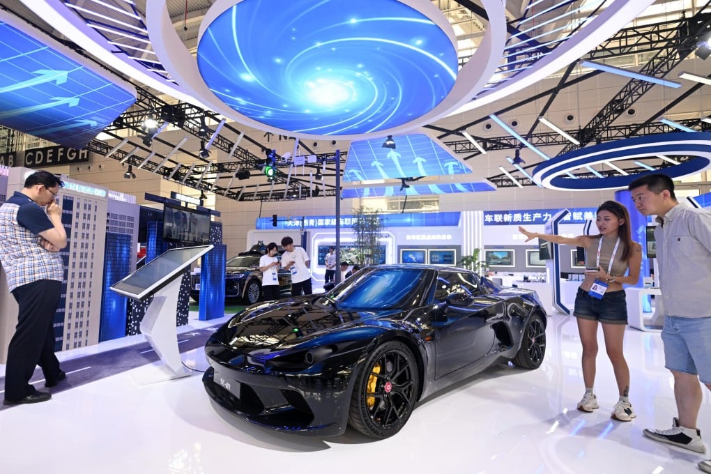 Visitors look at a new-energy sports car at an expo in Tianjin. Photo: Xinhua