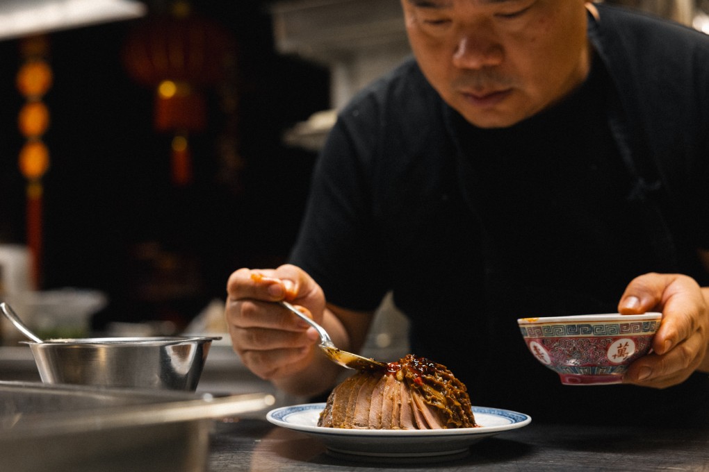 Surfers chef Cao Dayu prepares a dish at the Chinese restaurant in Stockholm, Sweden. The restaurant has come a long way from its humble roots on a Swedish island to become one of the capital’s most popular Chinese restaurants. Photo: Emil Lif