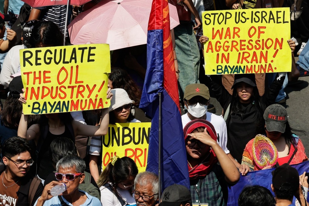 Protesters hold signs opposing fuel price increases in Manila, the Philippines, on Friday. Photo: EPA