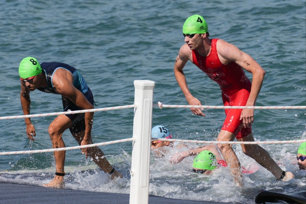 Robin Elg (right) emerges from the water during the National Games individual race last November. Photo: Eugene Lee