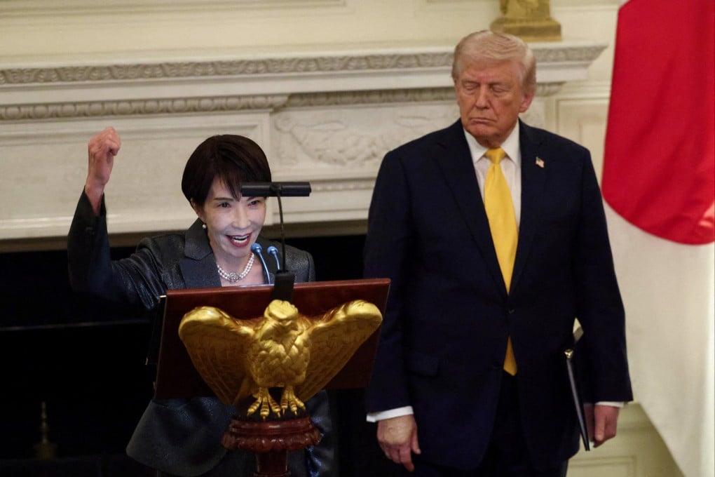 Japanese Prime Minister Sanae Takaichi raises her fist while delivering remarks during a dinner hosted by US President Donald Trump at the White House on Thursday. Photo: Reuters