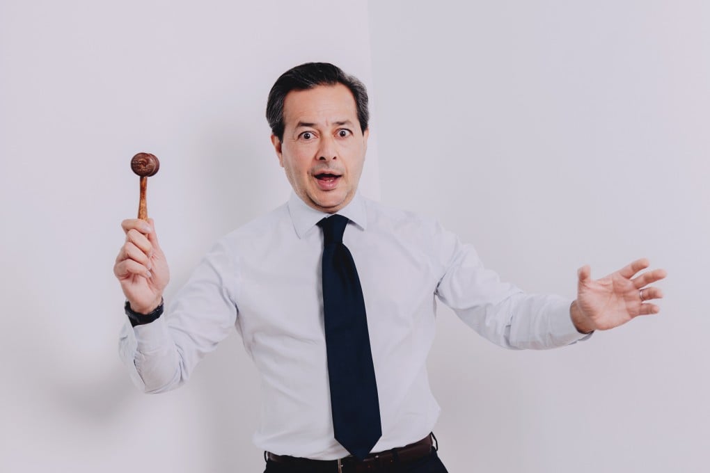 Christie’s auctioneer Rahul Kadakia and his billion-dollar gavel. Photo: Jocelyn Tam