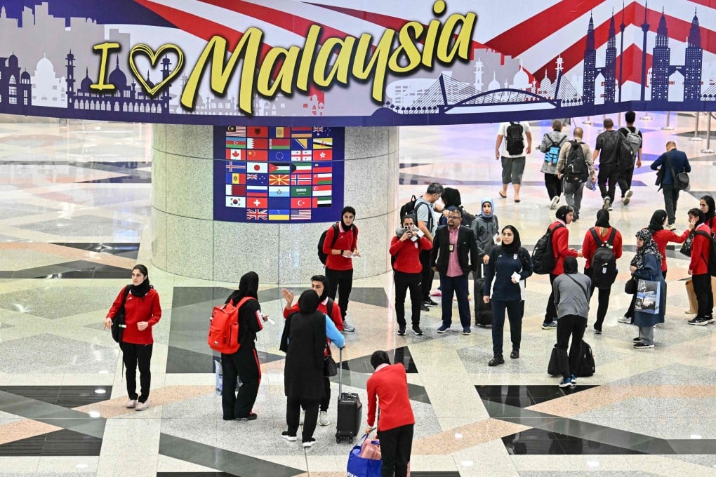 Members of the Iranian women’s football team seen at Kuala Lumpur International Airport on Monday after staying in a hotel in the Malaysian capital while awaiting the next leg of their journey home. Photo: AFP