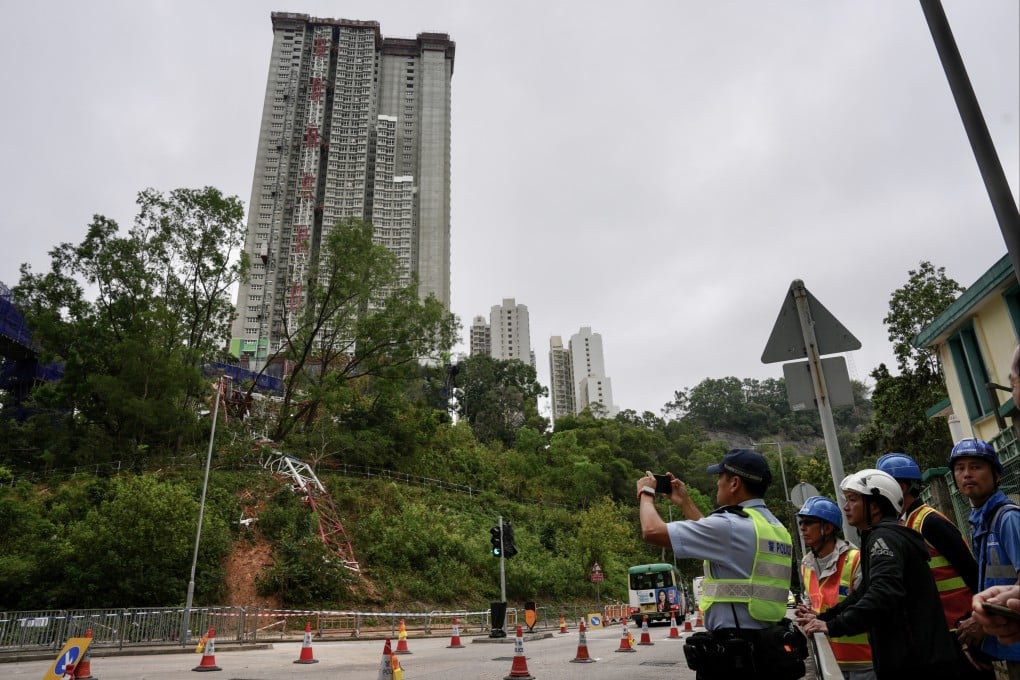 A police officer examines the site of a deadly tower crane collapse near Pik Kwai House in Kwai Chung on March 19. Photo: Jelly Tse