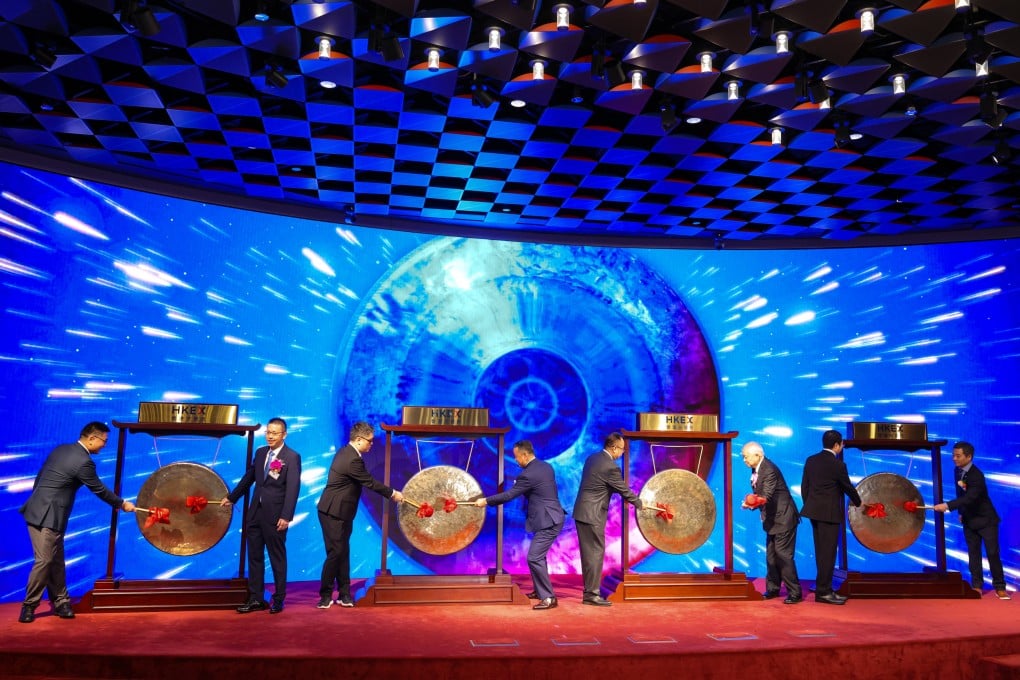 Representatives of four companies bang gongs at the Hong Kong stock exchange to celebrate their share debuts on November 6, 2025. Photo: Nora Tam