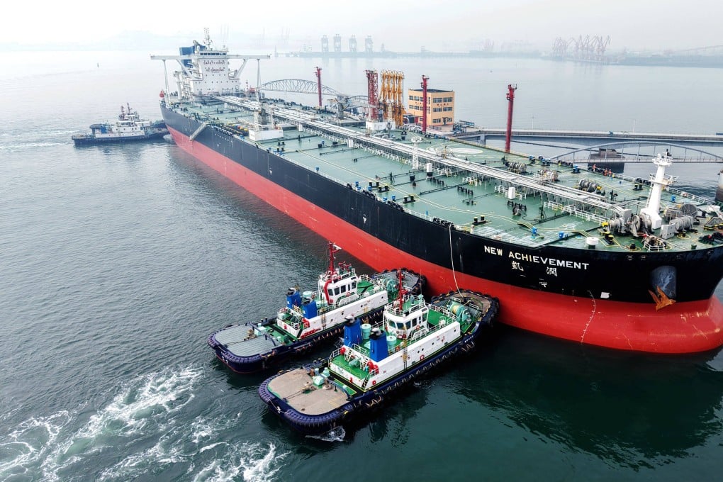 An oil tanker is guided to a berth at a port in Qingdao, Shandong province. China has oil reserves of 1.3 billion barrels, enough for four months of supply, according to UBS Group and S&P Global. Photo: AFP