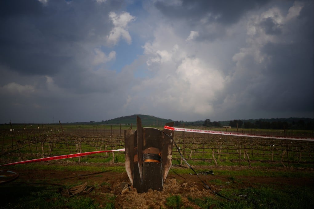 The fragment of a missile fired from Iran, and intercepted by Israel, sticks out in an open field in Israel-controlled Golan Heights. Photo: AP