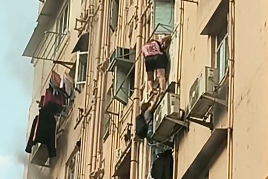 Two residents escaped the fire by climbing down the block. Photo: Handout