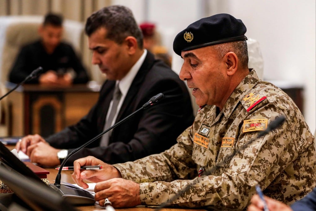 (left to right) Major General Saad Maan, head of the Security Media Cell, and Lieutenant General Walid Khalifa, commander of Baghdad Operations, attend a meeting at the Baghdad Operations Command headquarters in Baghdad on Wednesday. Photo: AFP