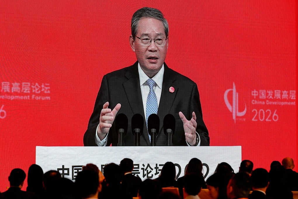 Chinese Premier Li Qiang is displayed on a large screen live broadcasting his speech at the opening of the China Development Forum 2026 held at the Diaoyutai State Guesthouse in Beijing on Sunday, March 22. Photo: AP