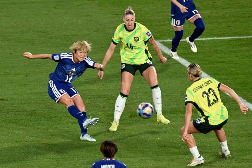 Japan’s England-based Maika Hamano (left) shoots and scores the winner in the final of the Womens Asian Cup against Australia on Saturday. Photo: AFP
