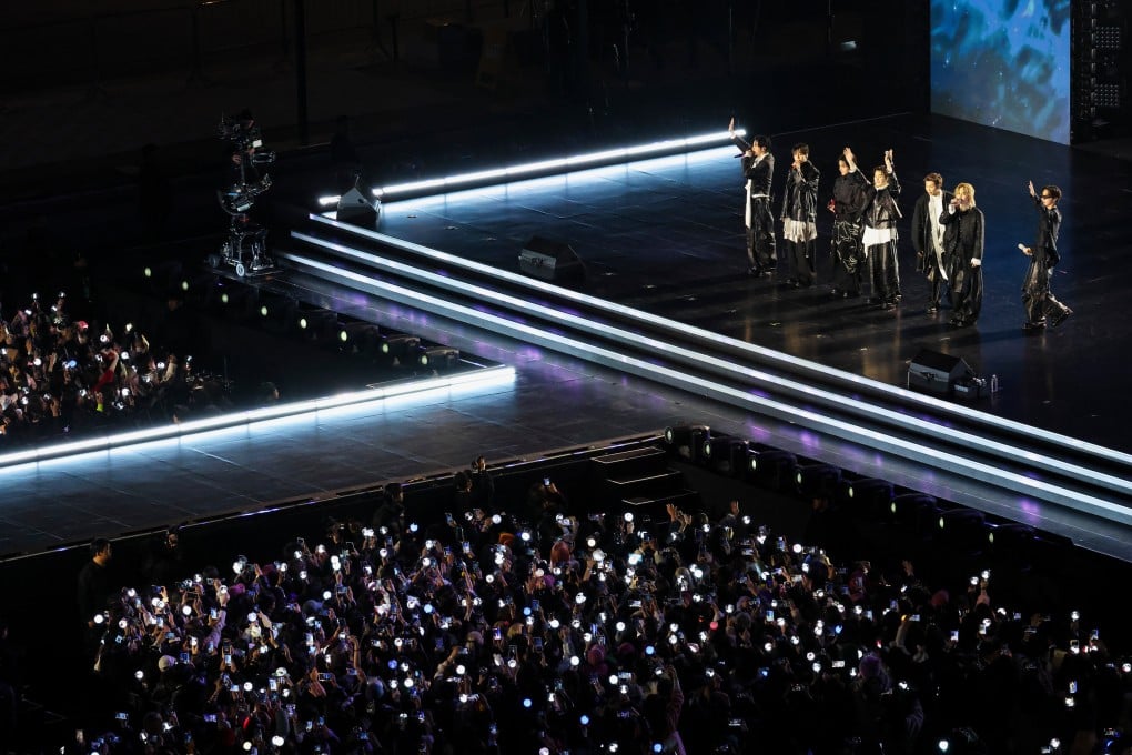 The members of K-pop group BTS wave at the end of their “BTS The Comeback Live Arirang” concert in central Seoul, South Korea, on Saturday. Photo: AP